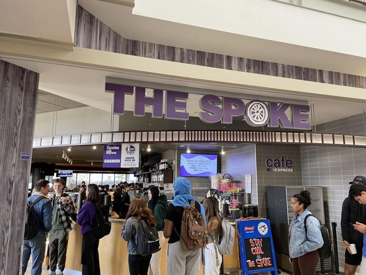 Interior entrance of a bar restaurant with a line of customers