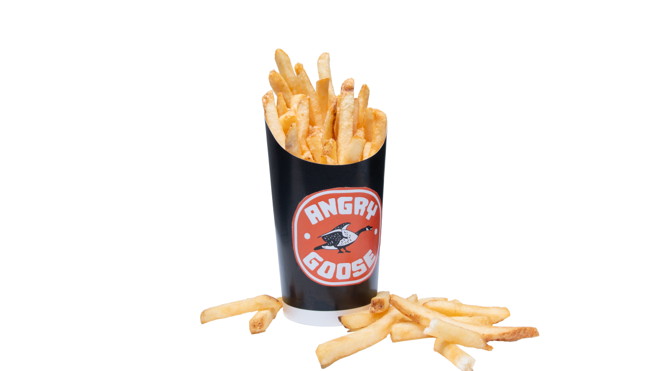 A fry cup loaded and overflowing with fries.